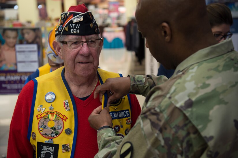U.S. Army Sgt. Maj. Derrick Durham, U.S. Army Reserves Directorate, U.S. Army Center for Initial Military Training senior enlisted advisor, pins a Vietnam Veteran Lapel Pin on a U.S. Air Force Vietnam Veteran at Joint Base Langley-Eustis, Virginia, March 29, 2019.