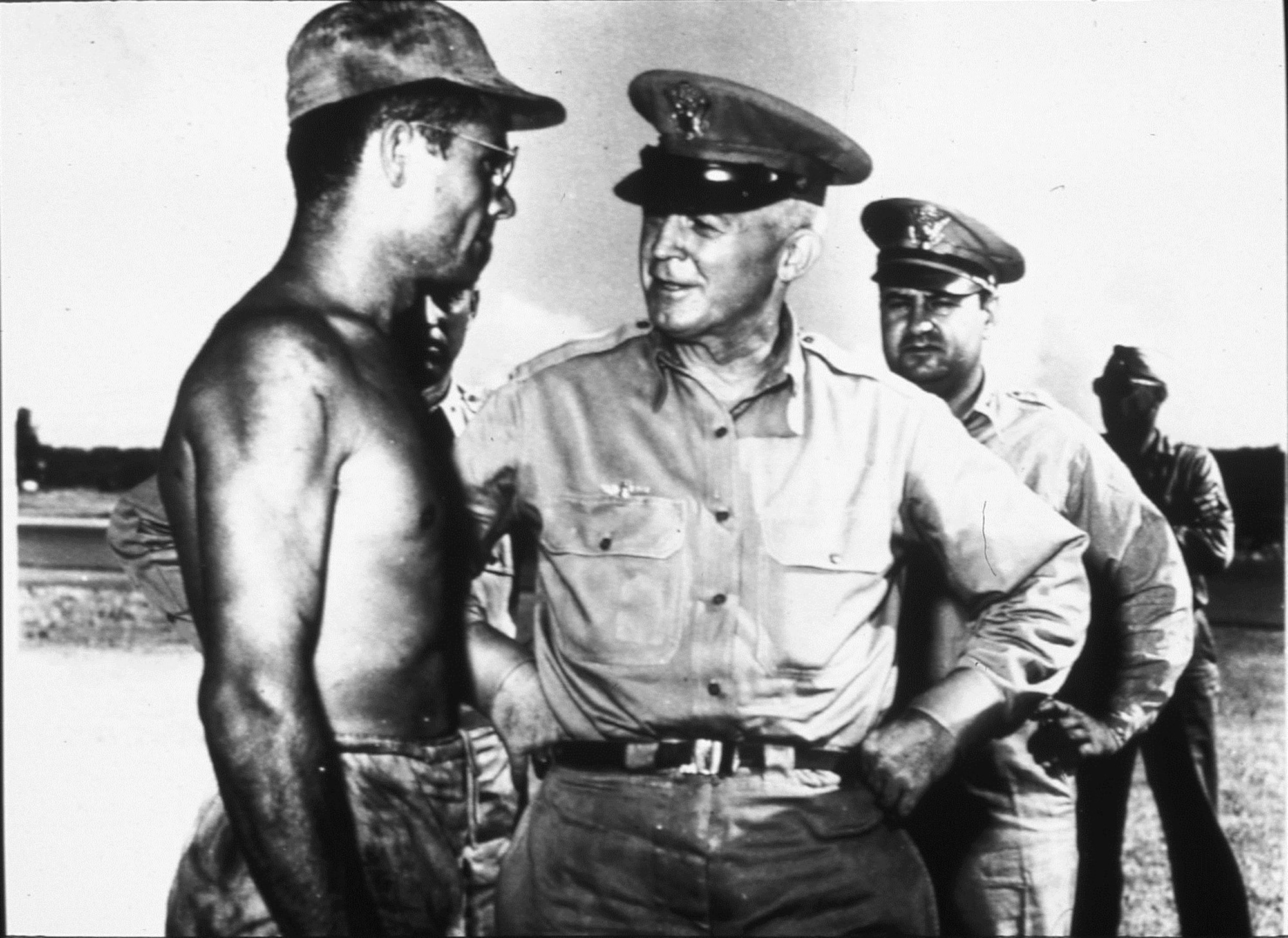 Gen. Henry H. “Hap” Arnold receives a report from B-29 maintainer SSgt Leo F. Fliess sometime in 1945. Maj. Gen. Curtis E. LeMay stands in the background. (Courtesy photo)