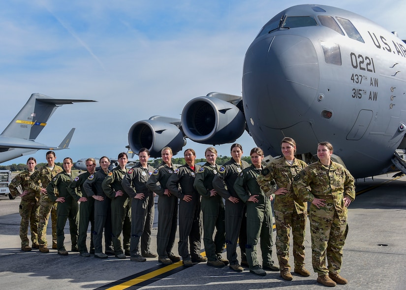 Several all-female air crews take a moment to pose as a team on the flightline March 31, 2019, at Joint Base Charleston, S.C., before departing for an incentive flight celebrating the end of Women's History Month.