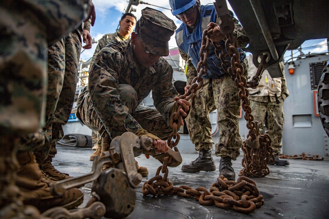 U.S. Marine Corps Pfc. Noe Quintanillo, an embarkations clerk with Marine Wing Headquarters Squadron 3, 3rd Marine Aircraft Wing, secures a Medium Tactical Vehicle Replacement truck on Landing Craft Unit 1629 during maritime movement operations at Port Hueneme, Calif., as part of Exercise Pacific Blitz 19, March 12.  PacBlitz19 is designed to train Marines and Sailors in maritime prepositioning force operations and aims to increase proficiency, expand levels of cooperation and to enhance maritime capabilities. (U.S. Marine Corps photo by Cpl. Jacob A. Farbo)