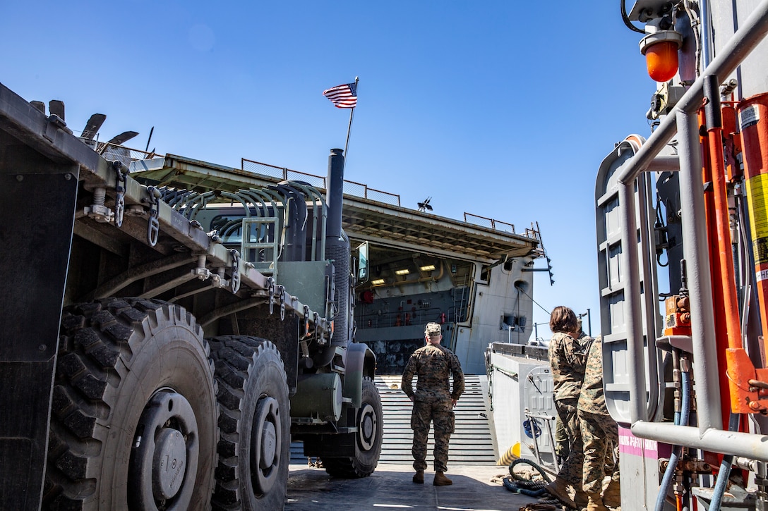 U.S. Marine Corps Chief Warrant Officer 2 Andrew Morgan, a supply mobility officer with I Marine Expeditionary Force, observes as a Landing Craft Utility prepares to dock in the USS Somerset (LPD 25) during maritime movement operations at Port Hueneme, Calif., as part of Exercise Pacific Blitz 19, March 12. PacBlitz19 is designed to train Marines and Sailors in maritime prepositioning force operations and aims to increase proficiency, expand levels of cooperation and to enhance maritime capabilities. (U.S. Marine Corps photo by Cpl. Jacob A. Farbo)