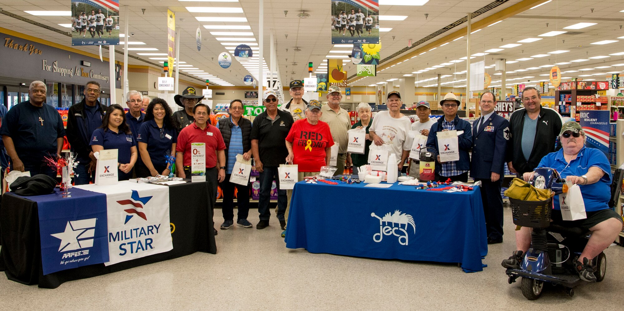 Vietnam veterans pose for a group photo at the March Air Reserve Base Commissary Calif., March 29, 2019, during the annual Vietnam War Veterans Day Ceremony. This ceremony is held to commemorate National Vietnam War Veterans Day. (U.S. Air 
Force photo by Staff Sgt. Bethany La Ville)