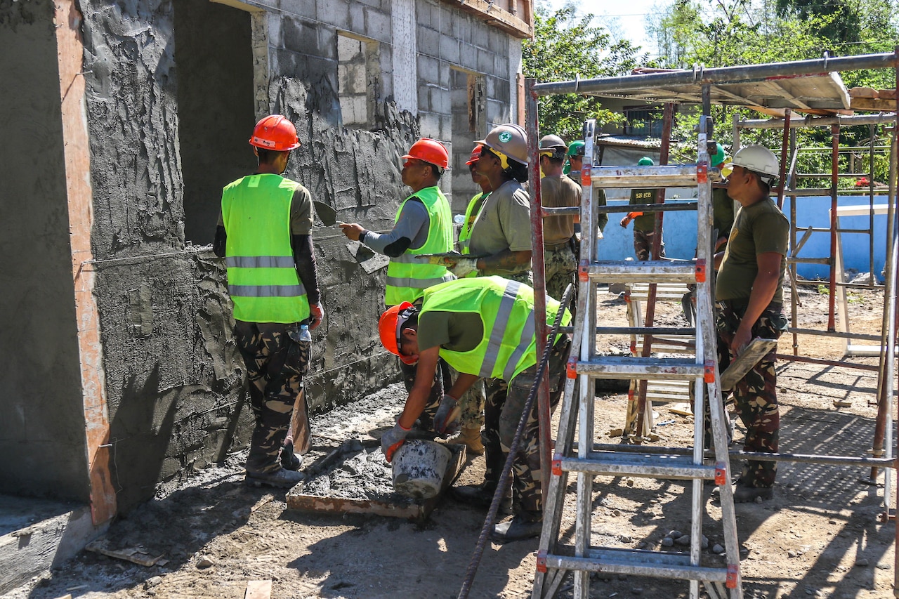 Troops perform construction work