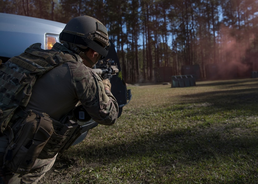 An Airman returns fire to the wood line during combat tactics training March 22, 2019, at Joint Base Charleston, S.C. - Naval Weapons Station.