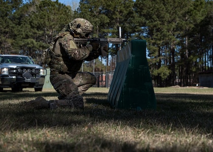 1st Lt. Paul Underwood, 628th Civil Engineer Squadron, Explosive Ordnance Disposal flight chief, returns fire from behind a barrier March 22, 2019, at Joint Base Charleston, S.C. - Naval Weapons Station.