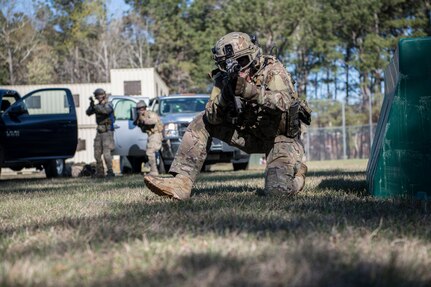 1st Lt. Paul Underwood, 628th Civil Engineer Squadron, Explosive Ordnance Disposal flight chief, returns fire from behind a barrier March 22, 2019, during combat tactics training at the Joint Base Charleston, S.C. - Naval Weapons Station.