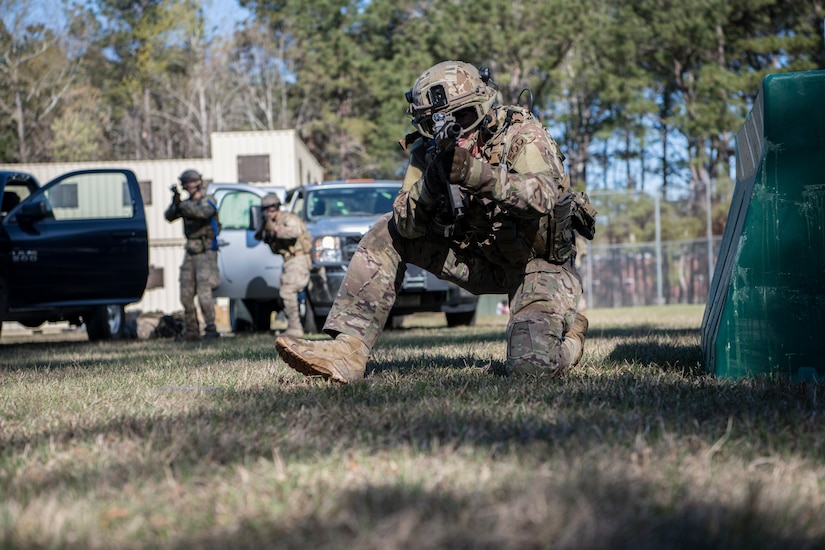 1st Lt. Paul Underwood, 628th Civil Engineer Squadron, Explosive Ordnance Disposal flight chief, returns fire from behind a barrier March 22, 2019, during combat tactics training at the Joint Base Charleston, S.C. - Naval Weapons Station.