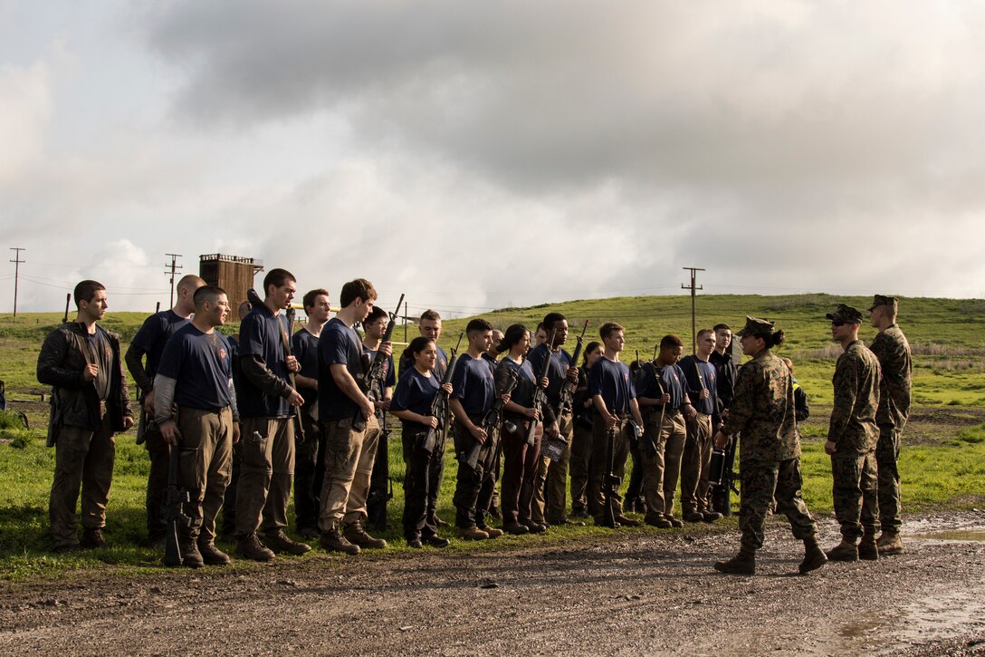 U.S. Marine Corps Officer candidates with Officer Selection Office Sacramento stand in a formation during a Mini Officer Candidate School at U.S. Army Reserve Camp Parks in Dublin, Calif., March 23, 2019. Mini OCS is designed to give candidates and applicants an idea of what to expect at Marine Corps Officer Candidate School. (U.S. Marine Corps photo by Sgt. Christian Cachola)