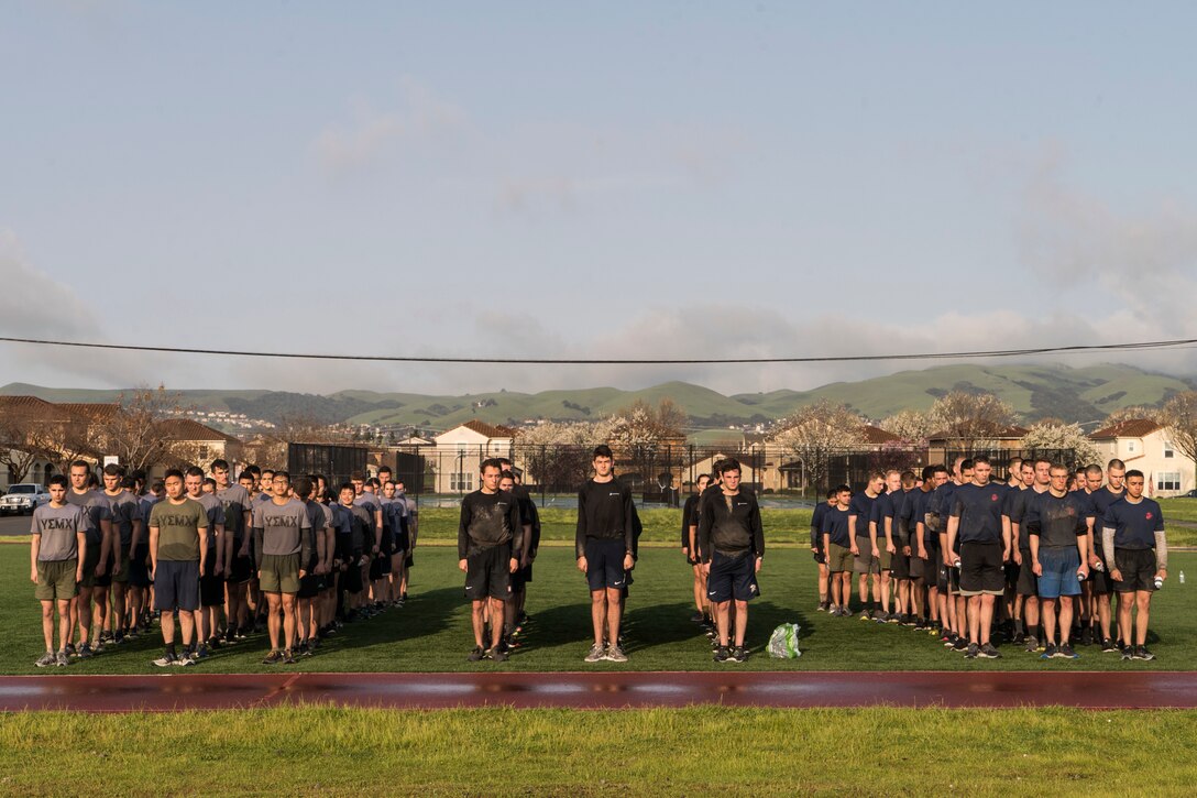 U.S. Marine Corps Officer candidates with Officer Selection Offices San Jose, Berkeley, and Sacramento stand in a formation during a Mini Officer Candidate School at U.S. Army Reserve Camp Parks in Dublin, Calif., March 23, 2019. Mini OCS is designed to give candidates and applicants an idea of what to expect at Marine Corps Officer Candidate School. (U.S. Marine Corps photo by Sgt. Christian Cachola)