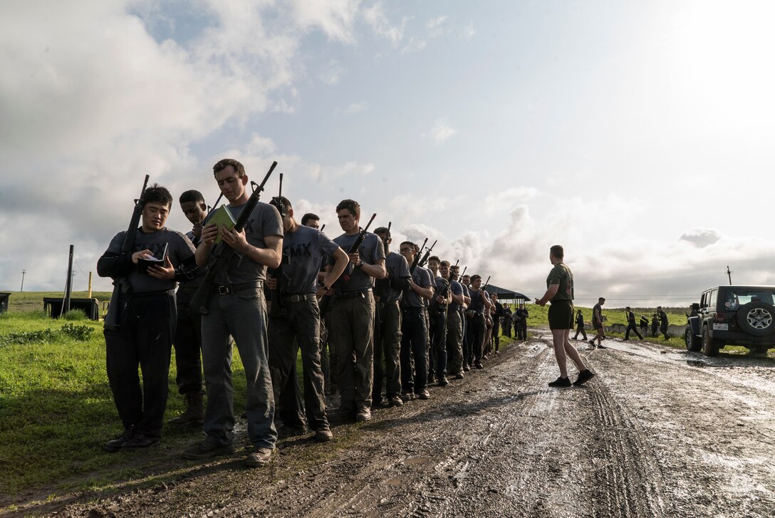 U.S. Marine Corps Officer candidates with Officer Selection Office Berkeley check their gear during a Mini Officer Candidate School at U.S. Army Reserve Camp Parks in Dublin, Calif., March 23, 2019. Mini OCS is designed to give candidates and applicants an idea of what to expect at Marine Corps Officer Candidate School. (U.S. Marine Corps photo by Sgt. Christian Cachola)