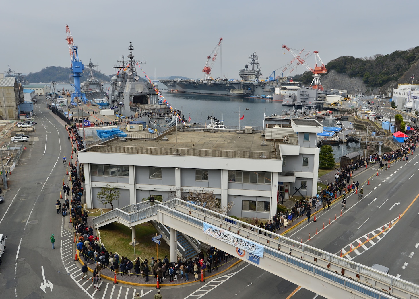 YOKOSUKA, Japan (March 30, 2019) – Visitors wait in line for a tour of the USS Chancellorsville (CG 62) during the 26th annual Spring Festival onboard Fleet Activities (FLEACT) Yokosuka. Fleet Activities Yokosuka provides, maintains, and operates base facilities and services in support of 7th Fleet's forward-deployed naval forces, 71 tenant commands, and more than 27,000 military and civilian personnel.