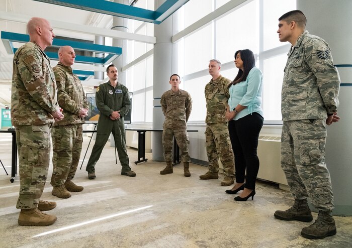 On the left, Chief Master Sgt. Chris Simpson, command chief, and Maj. Gen. Sam Barrett, commander, both from 18th Air Force, listen to Lorraine Kmiec, 436th Force Support Squadron management analyst, on the process and status of the wing’s Innovation Lab March 20, 2019, at Dover Air Force Base, Del. Kmiec and current members of the wing’s innovation team briefed Barrett and Simpson about completed, current and future innovation team projects. (U.S. Air Force photo by Roland Balik)