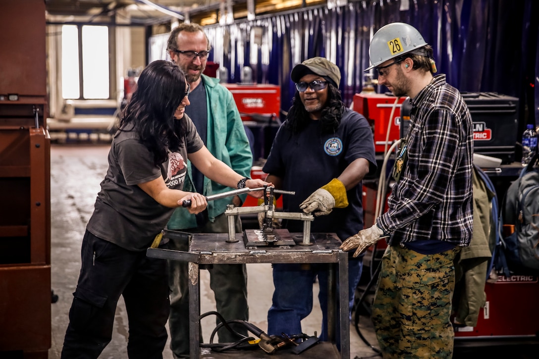 Subject Matter Expert Welding Instructor
Lamont Smith and his apprentices show off how the
welding jig he developed works.