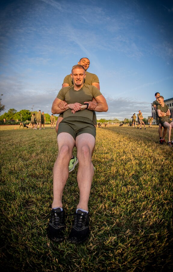 Marines with Marine Forces Reserve participate in a Total Force Fitness event at Marine Corps Support Facility New Orleans, March 29, 2019. The MARFORRES Marines conducted various physical activities, such as tug-of-war, buddy carries, high-intensity suicide drills, medicine ball exercises and the dissemble and assembly of a M4 Service Carbine. The event promoted physical fitness, unit cohesion and esprit de corps. (U.S. Marine Corps photo by Sgt. Andy O. Martinez)