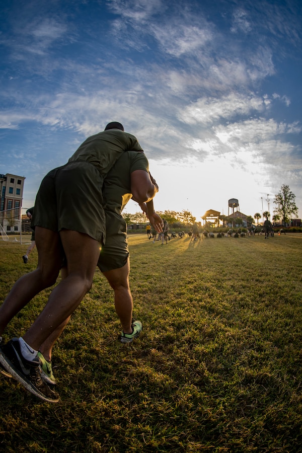 Marines with Marine Forces Reserve participate in a Total Force Fitness event at Marine Corps Support Facility New Orleans, March 29, 2019. The MARFORRES Marines conducted various physical activities, such as tug-of-war, buddy carries, high-intensity suicide drills, medicine ball exercises and the dissemble and assembly of a M4 Service Carbine. The event promoted physical fitness, unit cohesion and esprit de corps. (U.S. Marine Corps photo by Sgt. Andy O. Martinez)