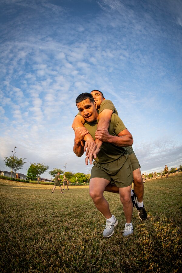 Marines with Marine Forces Reserve participate in a Total Force Fitness event at Marine Corps Support Facility New Orleans, March 29, 2019. The MARFORRES Marines conducted various physical activities, such as tug-of-war, buddy carries, high-intensity suicide drills, medicine ball exercises and the dissemble and assembly of a M4 Service Carbine. The event promoted physical fitness, unit cohesion and esprit de corps. (U.S. Marine Corps photo by Sgt. Andy O. Martinez)