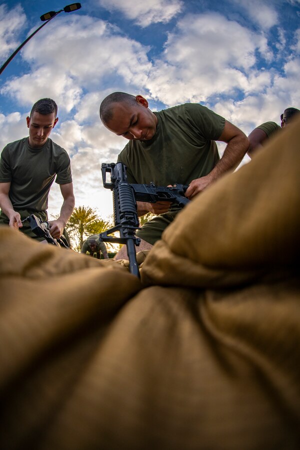 A Marine with Marine Forces Reserve assembles a M4 Service Carbine at Marine Corps Support Facility New Orleans, March 29, 2019, during a Total Force Fitness event. The MARFORRES Marines conducted various physical activities, such as tug-of-war, buddy carries, high-intensity suicide drills, medicine ball exercises and the dissemble and assembly of a M4 Service Carbine. The event promoted physical fitness, unit cohesion and esprit de corps. (U.S. Marine Corps photo by Sgt. Andy O. Martinez)
