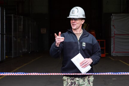 Norfolk Naval Shipyard Commander Capt. Kai Torkelson explains the value of the Point of Use to guests at the ribbon cutting ceremony March 8.