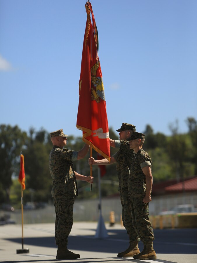Sgt. Maj. Justin Gruber, sergeant major of Marine Light Attack Helicopter Squadron (HMLA) 469, passes the unit colors to Col. Ryan Cherry during a change of command ceremony on Camp Pendleton, Calif., March. 29, 2019. Lt. Col. Ryan A. Cherry relinquished command to Lt. Col. Ryan P. Welborn, who committed to continue a legacy of operational and professional excellence into the future.. (U.S. Marine Corps photo by Cpl. Jacob Pruitt)