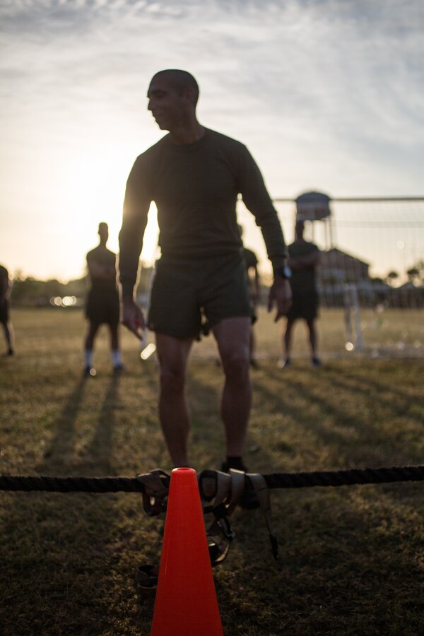 Maj. Emre Albayrak, operations officer with Headquarters Battalion, Marine Forces Reserve, gives instructions to prepare Marines for a tug of war competition during a Total Force Fitness event at Marine Corps Support Facility New Orleans, March 29, 2019. The purpose of the event was to boost unit cohesion, morale and maintain high physical fitness standards. (U.S. Marine Corps photo by Sgt. Dante J. Fries)