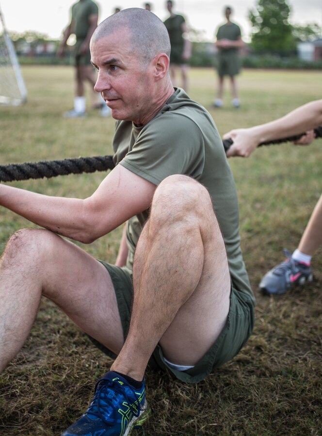 Col. Torrens G. Miller, commanding officer of Headquarters Battalion, Marine Forces Reserve, competes in a tug of war competition during a Total Force Fitness event at Marine Corps Support Facility New Orleans, March 29, 2019. The purpose of the event was to boost unit cohesion, morale and maintain high physical fitness standards.