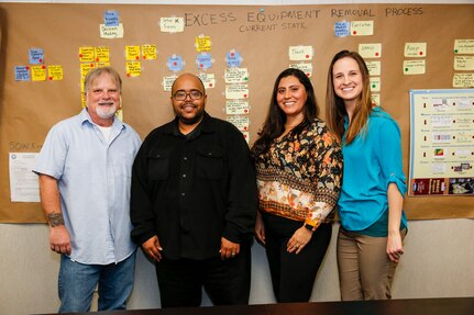 FROM LEFT TO RIGHT: Norfolk Naval Shipyard's Kelly Carson, Code 100PI Engineering Technician; Khiari Tyler, Code 100PI Master Black Belt Instructor and NAVSEA Lean Six Sigma College Branch Head; Clara Cuervo, Code 100PI Industrial Engineer; Megan Hanni, Code 100PI Engineering Technician.