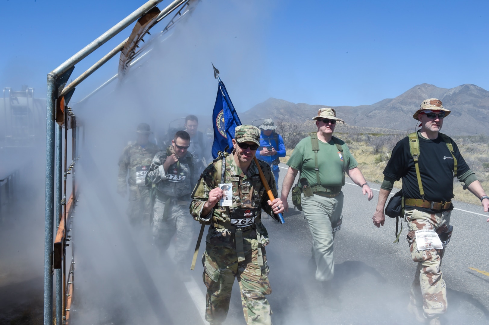 For the fourth-consecutive year, Chief Master Sgt. Benjamin “Jake” Higginbotham, DIA's command senior enlisted leader, marched in honor of Francis Bania, who was a prisoner of war for more than 1,200 days during World War II.