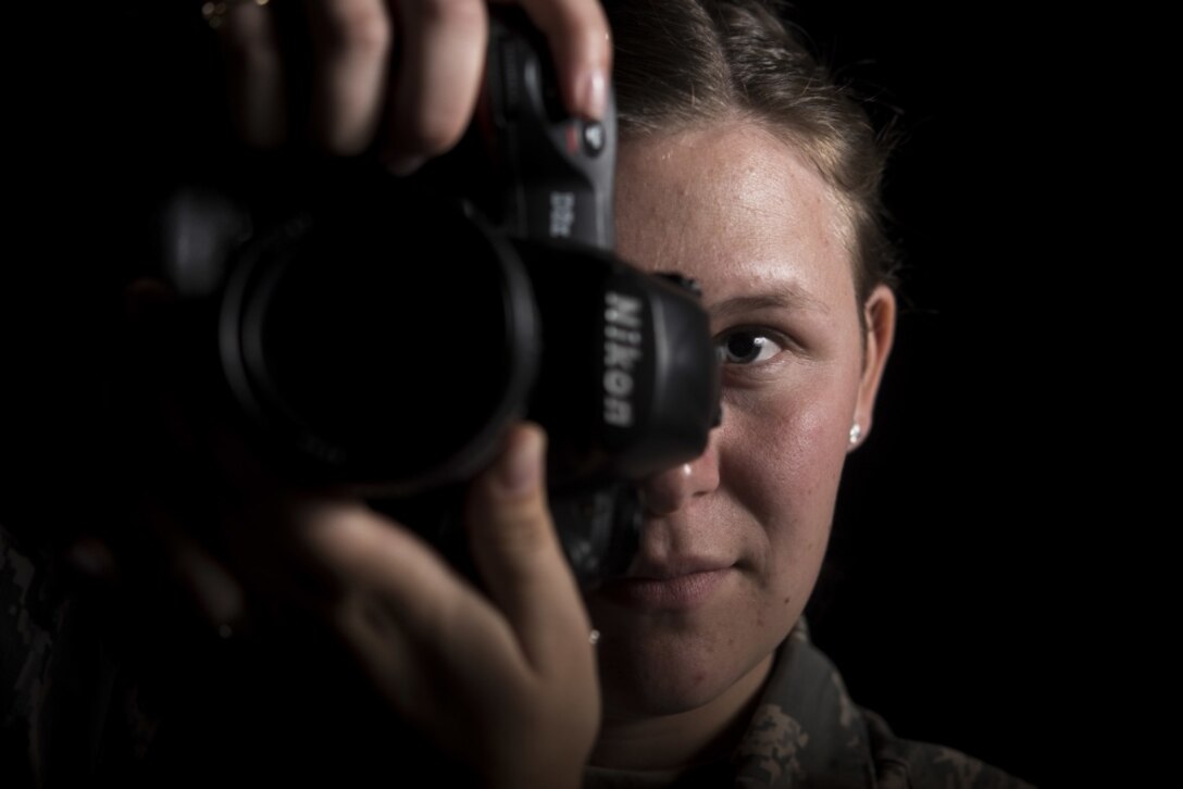 Airman 1st Class Aubree Milks, 30th Space Wing Public Affairs photojournalist, prepares to take a photo April 2, 2019, at Vandenberg Air Force Base, Calif. Milks documents Vandenberg AFB's rocket launches and other missions across base. (U.S. Air Force photo by Airman 1st Class Hanah Abercrombie)