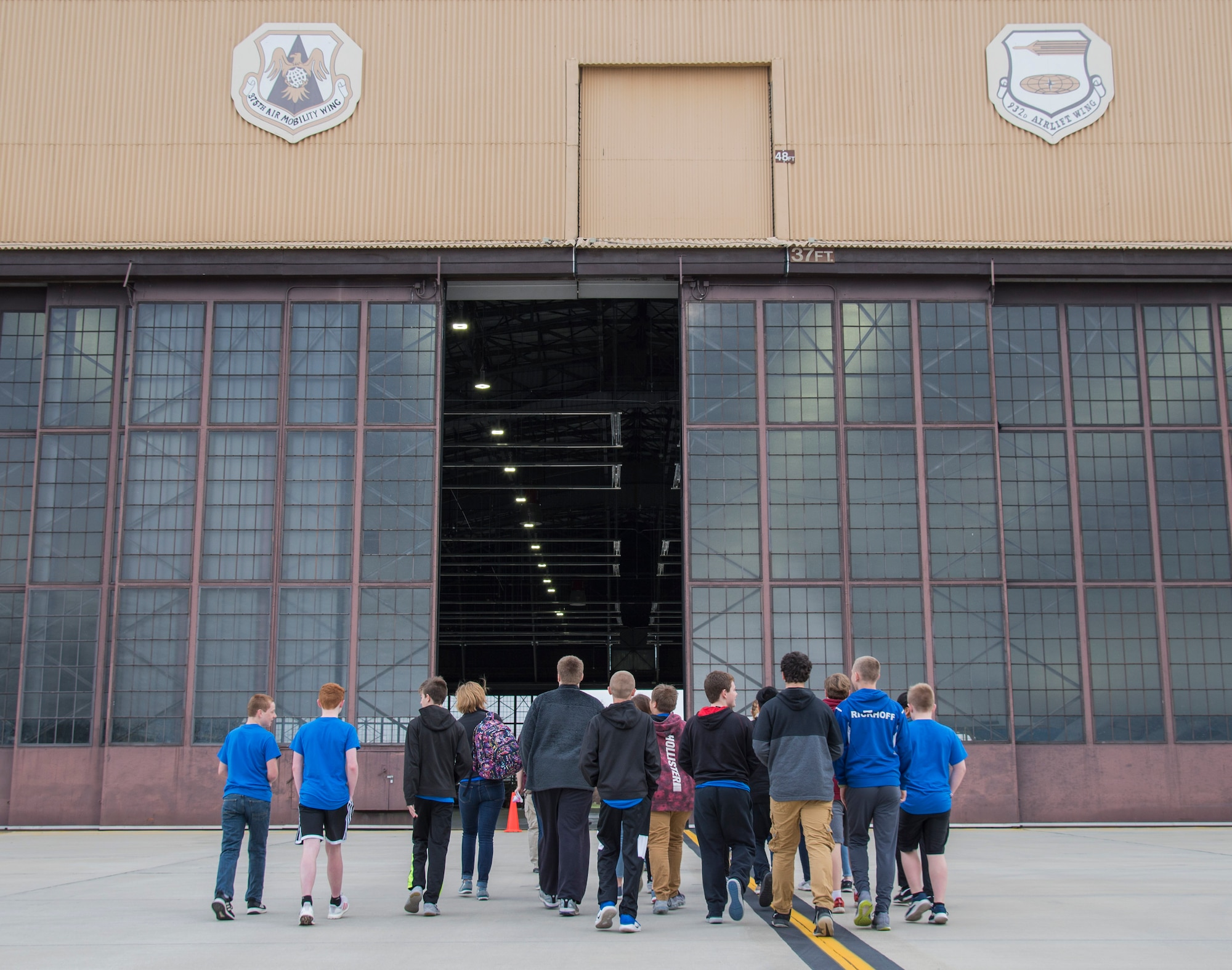 Students from Albers Elementary School enter Hangar 1 at the beginning of the 2019 science, technology, engineering, arts, and math day celebration at Scott Air Force Base, Ill., March 28, 2019. Over 450 students from schools in Illinois and Missouri traveled to Scott AFB for STEAM day which allowed members of team Scott use the elements of STEAM in their daily job. (U.S Air Force photo by Airman 1st Class Nathaniel Hudson)
