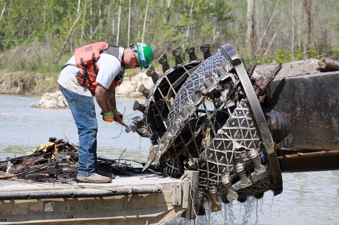 A U.S. Army Engineer, Galveston District contractor clears trapped debris from a cutter head from the Dredge "LP" during operations  near Kingwood, Texas upstream of West Lake Houston Parkway.   Since Sept. 20, 2018, approximately 1.4 million cubic yards of Hurricane Harvey silt and debris was pumped to two placement areas. The FEMA funded emergency flood action is scheduled for completion in early May 2019.