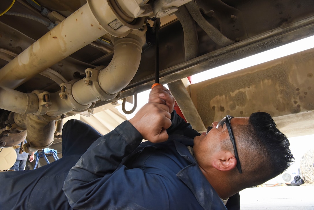 Senior Airman Ismael Garcia, 380th Expeditionary Logistics Readiness Squadron general-purpose mechanic, opens and closes a tank to pump of a refueler truck at Al Dhafra Air Base, United Arab Emirates, Mar. 28, 2019.
