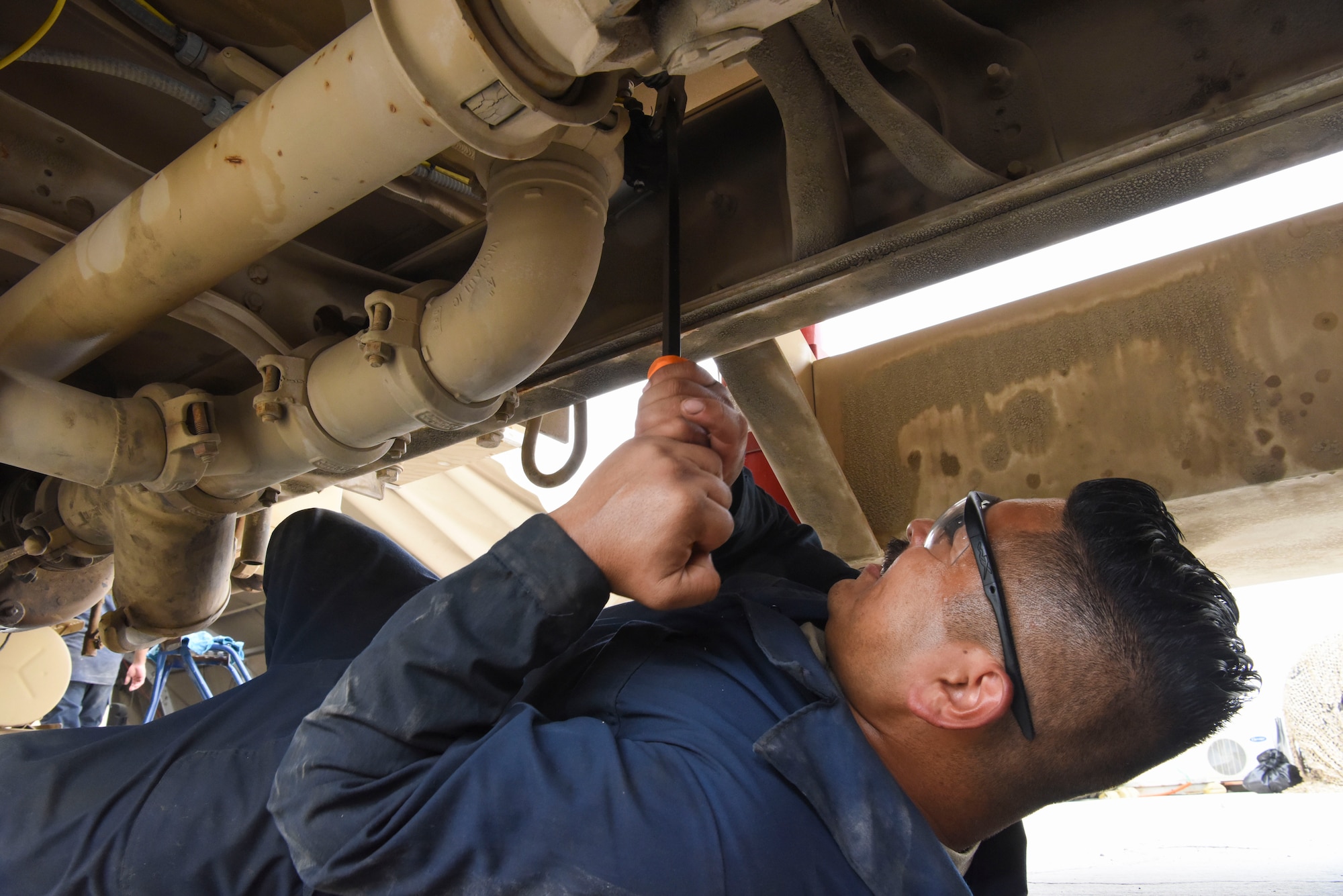 Senior Airman Ismael Garcia, 380th Expeditionary Logistics Readiness Squadron general-purpose mechanic, opens and closes a tank to pump of a refueler truck at Al Dhafra Air Base, United Arab Emirates, Mar. 28, 2019.