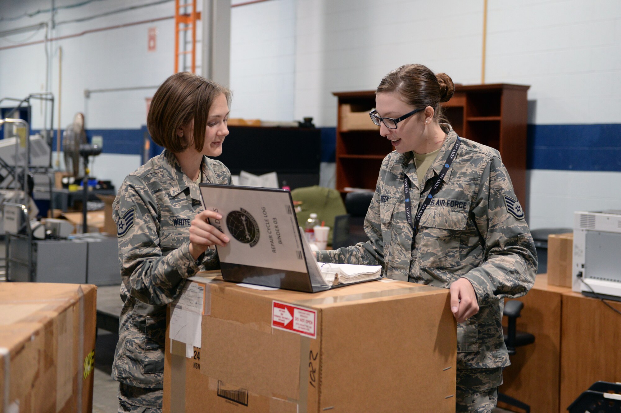 Staff Sgt. Destine White, 55th Logistics Readiness Squadron NCO in charge of equipment accounts, assists Staff Sgt. Falena Green, 595th Aircraft Maintenance Squadron, with returning an aircraft part in the Bennie L. Davis Maintenance Facility Warehouse Monday, Oct. 16, 2017, on Offutt Air Force Base, Nebraska. Green is a regular customer of the warehouse bringing aircraft parts for repair and picking up new parts to take back to her unit. (U.S. Air Force photo by Tech. Sgt. Rachelle Blake)
