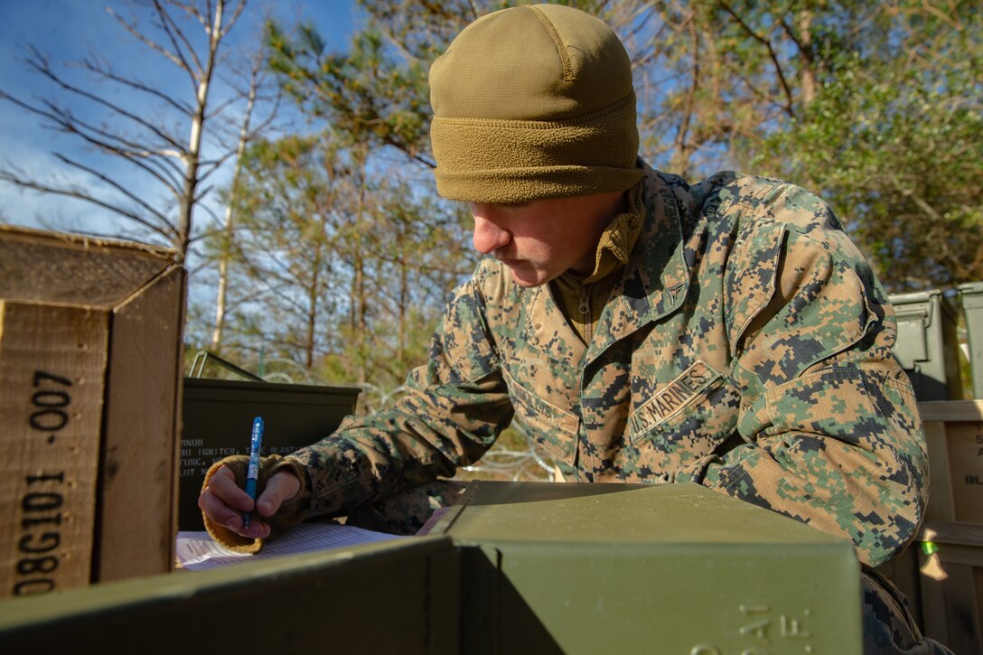 U.S. Marine Lance Cpl. Landon Wallis with Ammunition Company, 2nd Supply Battalion, Combat Logistics Group 25, 2nd Marine Logistics Group, counts ammunition on Camp Lejeune, N.C., March 27, 2019. Ammo Co. constructed a Field Ammunition Supply Point in support of 2nd Marine Division to supply everything from 5.56 millimeter small arms to high explosive ordnance. (U.S. Marine Corps photo by Lance Cpl. Damion Hatch Jr.)