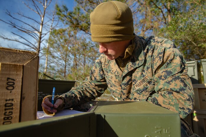 U.S. Marine Lance Cpl. Landon Wallis with Ammunition Company, 2nd Supply Battalion, Combat Logistics Group 25, 2nd Marine Logistics Group, counts ammunition on Camp Lejeune, N.C., March 27, 2019. Ammo Co. constructed a Field Ammunition Supply Point in support of 2nd Marine Division to supply everything from 5.56 millimeter small arms to high explosive ordnance. (U.S. Marine Corps photo by Lance Cpl. Damion Hatch Jr.)