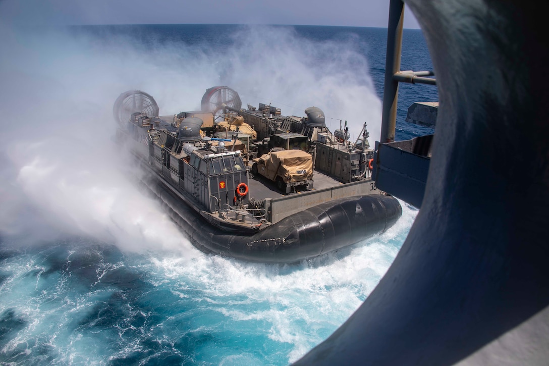U.S. 5TH FLEET AREA OF OPERATIONS (March 29, 2019) A landing craft, air cushion approaches the Wasp-class amphibious assault ship USS Kearsarge (LHD 3). Kearsarge is the flagship for the Kearsarge Amphibious Ready Group and with the embarked the 22nd Marine Expeditionary Unit is deployed to the U.S. 5th Fleet area of operations in support of naval operations to ensure maritime stability and security in the Central Region, connecting the Mediterranean and the Pacific through the western Indian Ocean and three strategic choke points. (U.S. Navy photo by Mass Communication Specialist 3rd Class Kaitlyn E. Eads/Released)