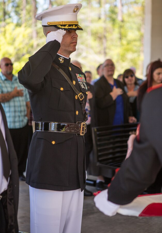 Col. Torrens G. Miller, commanding officer of Headquarters Battalion, Marine Forces Reserve, renders a hand salute during the playing of “Taps” for retired Lt. Col. Dennis Stegall’s funeral ceremony at Southeast Louisiana Veterans Cemetery on April 1, 2019. Stegall retired from the Marine Corps after 23 years of service in 2006 and continued to serve as the Marine Corps deputy comptroller for MARFORRES. (U.S. Marine Corps photo by Sgt. Dante J. Fries)