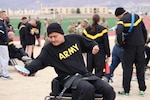 Spc. Kevin Holyan launches a few practice seated discus throws prior to the field event March 11, during the Army Trials at Fort Bliss, Texas. The 2019 Army Trials is an adaptive sports competition with more than 100 wounded, ill and injured active-duty Soldiers and veterans competing in 14 different sports for the opportunity to represent Team Army at the 2019 Department of Defense Warrior Games in Tampa, Florida.