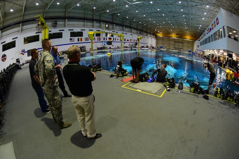 Tommy Sondag and Staff Sgt. Jake Strait, 47th OSS aircrew flight equipment parachute technicians, are introduced to the Neutral Buoyancy Lab, at Ellington Airport, Texas, March 26, 2019. Sondag and Strait visited NASA to share knowledge on packing the T-38 Talon parachute, and during their visit they managed to squeeze in time for a tour of NASA’s facilities. (U.S. Air Force photo by Senior Airman Benjamin N. Valmoja)