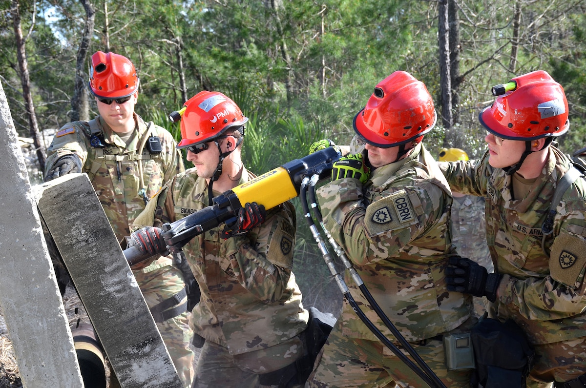 Soldiers with the Kentucky National Guard CBRNE Enhanced Response Force Package, or CERFP, use a hammer drill to extract a simulated victim from a rubble pile during an exercise evaluation at Camp Blanding, Fla., Jan. 10, 2019. The CERFP was tasked with responding to a 10-kiloton nuclear explosion, establishing a support zone, searching the hot zone for victims, extracting and decontaminating the victims, and providing medical assistance. (U.S. Army National Guard photo by Sgt. Taylor Tribble)