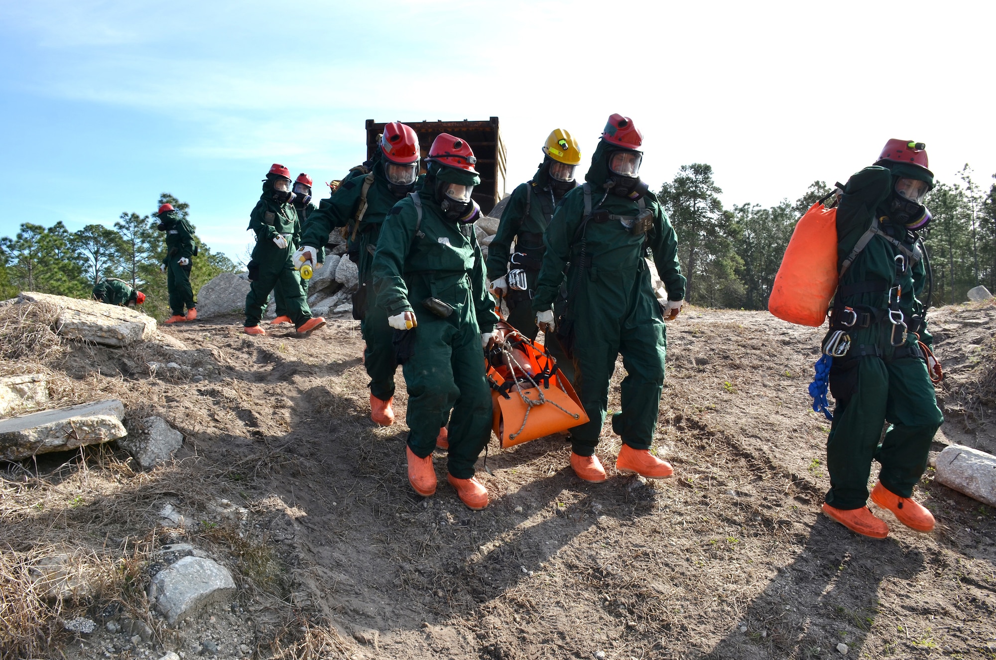 Guardsmen with Kentucky's CBRNE Enhanced Response Force package, or CERFP, walk a simulated victim off a rubble pile after a low-angle extraction during an exercise evaluation at Camp Blanding, Fla., Jan. 10, 2019. The CERFP was tasked with responding to a 10-kiloton nuclear explosion, establishing a support zone, searching the hot zone for victims, extracting and decontaminating the victims, and providing medical assistance. (U.S. Army National Guard photo by Sgt. Taylor Tribble)