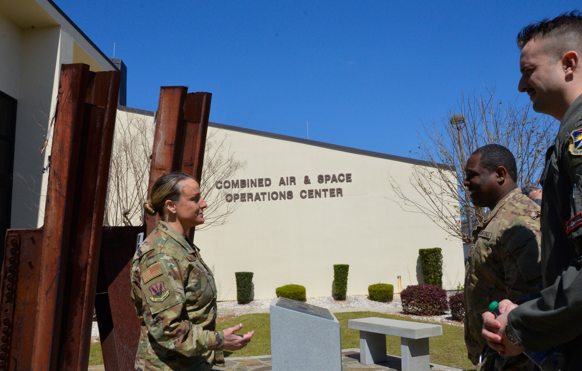 Chief Master Sgt. Karrie Bennett, 601st Air Operations Center Chief Enlisted Manager, talks with Master Sgt. Quintin Johnson, Continental U.S. NORAD Region Senior NCO of the Year, 1st Air Force, Detachment 2 and Capt. Jordan Gegner, CONR Aerospace Control Alert Pilot of the Year, 142nd Fighter Wing, Portland, Ore., during a tour of the 601st Air Operations Center March 27. (U.S. Air Force photo by Mary McHale)