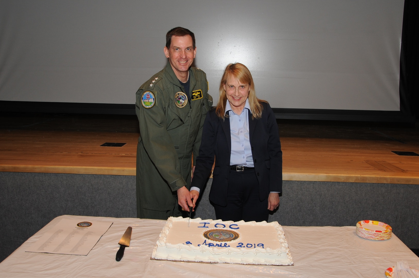 U.S. Navy Vice Adm. David Kriete, deputy commander of U.S. Strategic Command (USSTRATCOM), and Elizabeth Durham-Ruiz, director of USSTRATCOM Nuclear Command, Control and Communications (NC3) Enterprise Center, cut the cake following the announcement of USSTRATCOM’s Nuclear Command, Control and Communications Enterprise Center (NEC) meeting all requirements declaring initial operational capability at Offutt Air Force, Neb., April 3, 2019.
