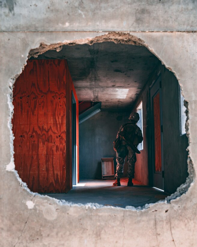 A U.S Marine with 1st Battalion, 7th Marine Regiment, 1st Marine Division, looks out of a window during Integrated Training Exercise (ITX) 2-19 at Range 220 on Marine Corps Air Ground Combat Center, Twentynine Palms, Calif., Feb. 9, 2019. The purpose of ITX is to create a challenging, realistic training environment that produces combat-ready forces capable of operating as an integrated Marine Air Ground Task Force. (U.S. Marine Corps photo by Lance Cpl. Colton Brownlee)