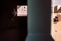 A U.S Marine with 1st Battalion, 7th Marine Regiment, 1st Marine Division, looks out of a window during Integrated Training Exercise (ITX) 2-19 at Range 220 on Marine Corps Air Ground Combat Center, Twentynine Palms, Calif., Feb. 9, 2019. The purpose of ITX is to create a challenging, realistic training environment that produces combat-ready forces capable of operating as an integrated Marine Air Ground Task Force. (U.S. Marine Corps photo by Lance Cpl. Colton Brownlee)