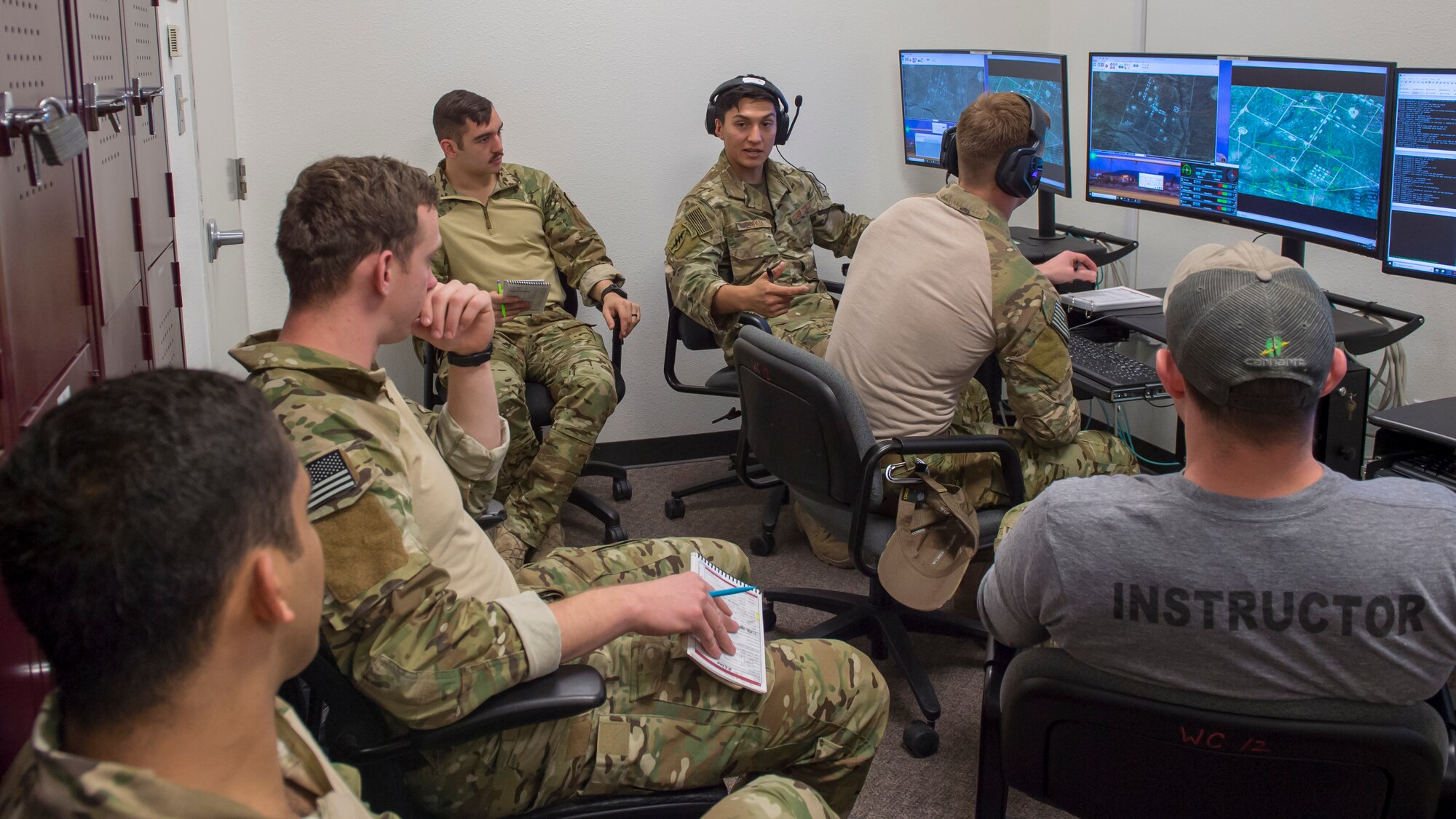 Senior Airman Leodan, 7th Air Support Operations Squadron joint terminal attack controller, demonstrates how to call in an air strike for members of the 351st Special Warfare Training Squadron, March 13, 2019, at the 16th Training Squadron on Holloman Air Force Base, N.M. The combat rescue officer students are getting this familiarization and level of training because they might find themselves in a situation where they need to bring close air support on a mission. (U.S. Air Force photo by Airman 1st Class Kindra Stewart)