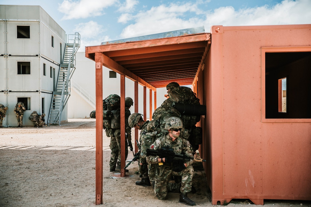 U.K. Royal Marines with 45 Commando, participate in Integrated Training Exercise (ITX) 2-19 at Range 220, Marine Corps Air Ground Combat Center, Twentynine Palms, Calif. Feb. 9, 2019. ITX creates a challenging, realistic training environment that produces combat-ready forces capable of operating as an integrated Marine Air Ground Task Force. (U.S. Marine Corps photo by Cpl. Jennessa Davey)