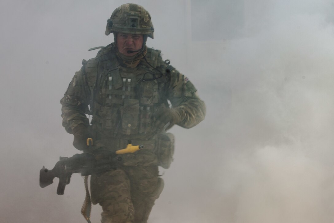 A U.K. Royal Marine with 45 Commando moves his position during Integrated Training Exercise (ITX) 2-19 at Range 220, Marine Corps Air Ground Combat Center, Twentynine Palms, Calif. Feb. 9, 2019. ITX creates a challenging, realistic training environment that produces combat-ready forces capable of operating as an integrated Marine Air Ground Task Force. (U.S. Marine Corps photo by Cpl. Conner Downey)