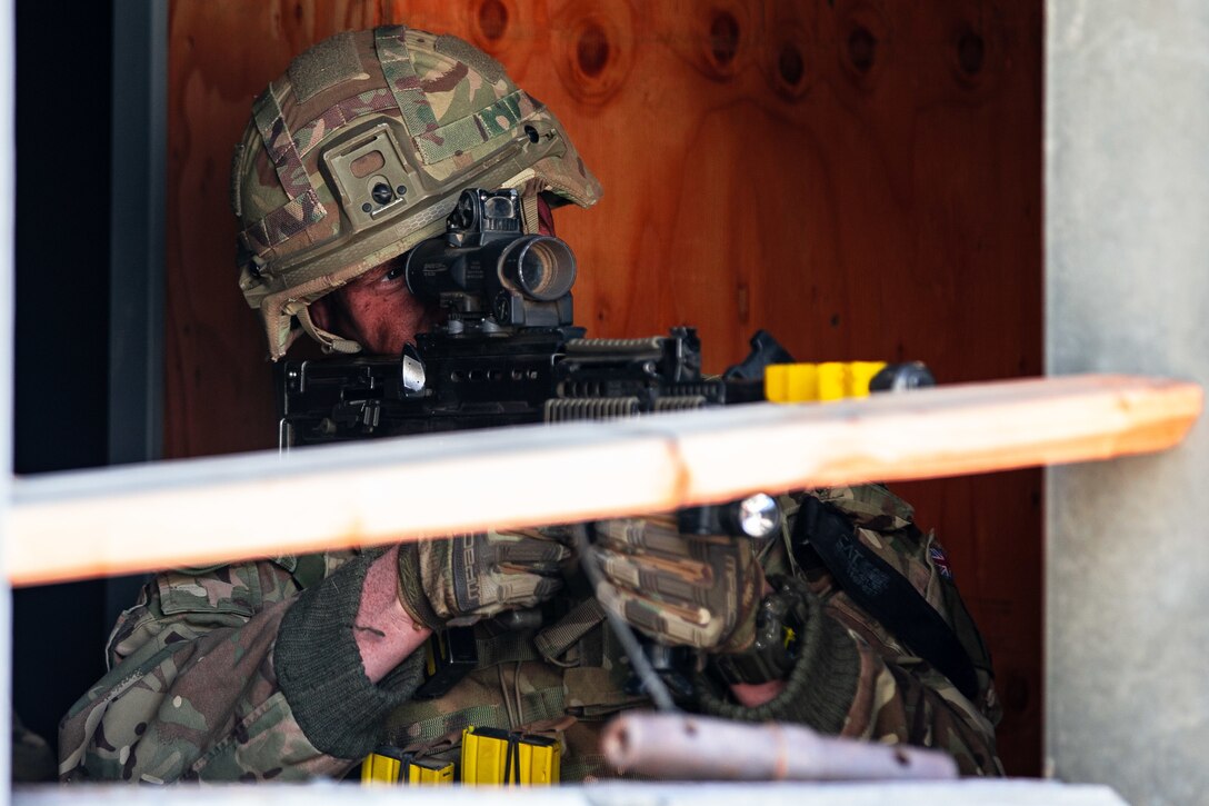 A U.K. Royal Marine with 45 Commando sights in on the enemy during Integrated Training Exercise (ITX) 2-19 at Range 220, Marine Corps Air Ground Combat Center, Twentynine Palms, Calif. Feb. 9, 2019. ITX creates a challenging, realistic training environment that produces combat-ready forces capable of operating as an integrated Marine Air Ground Task Force. (U.S. Marine Corps photo by Cpl. Conner Downey)