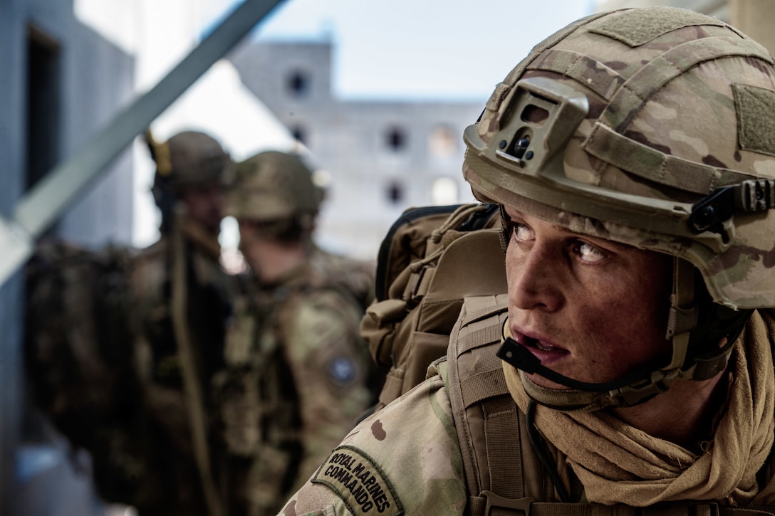 A U.K. Royal Marine with 45 Commando keeps watch during Integrated Training Exercise (ITX) 2-19 at Range 220, Marine Corps Air Ground Combat Center, Twentynine Palms, Calif. Feb. 9, 2019. ITX creates a challenging, realistic training environment that produces combat-ready forces capable of operating as an integrated Marine Air Ground Task Force. (U.S. Marine Corps photo by Cpl. Conner Downey)